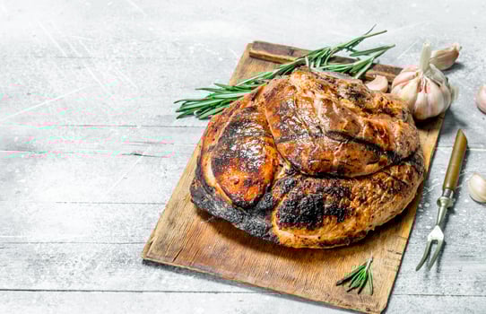 Big grilled pork steak with spices and herbs. photo