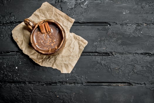 Hot chocolate with cinnamon sticks. photo