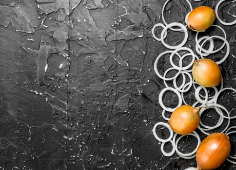 Rings and heads of yellow onions. photo