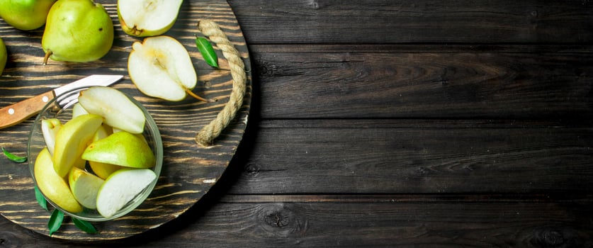 The pear slices on the tray with a knife. photo