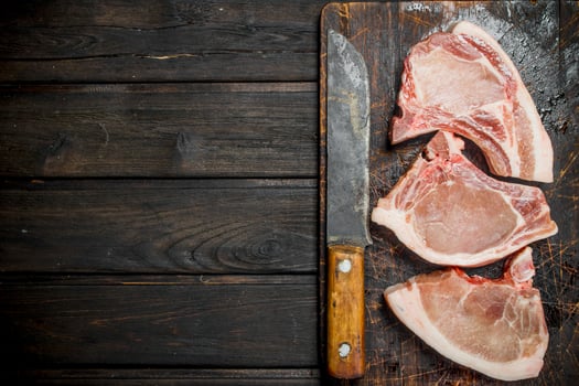 Raw pork steaks on the bone. photo
