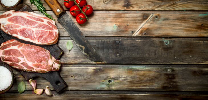 Raw pork steaks with tomatoes and spices. photo