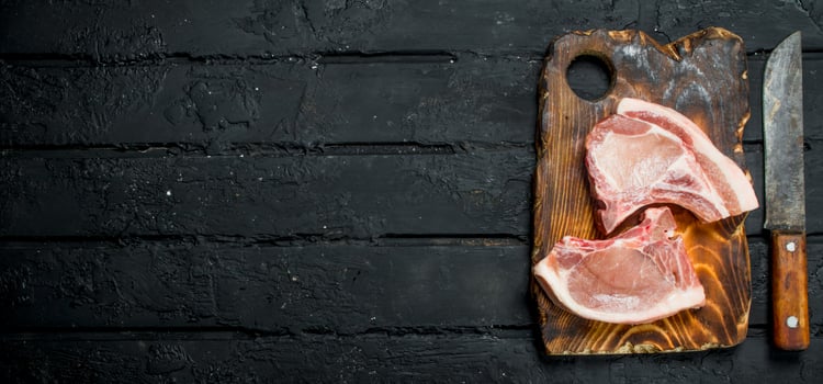 Raw pork steaks on the bone. photo