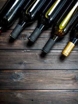 Bottles of white and red wine. photo