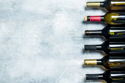 Wine background. Bottles of red and white wine. photo