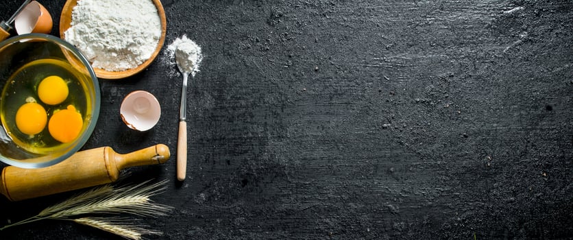 Flour with eggs in bowls. photo