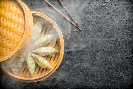 Hot gedza dumplings in a bamboo steamer. photo