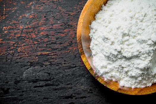 Wheat flour in bowl. photo