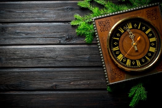 Retro Christmas clock with fir branches. photo