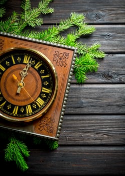 Retro Christmas clock with fir branches. photo