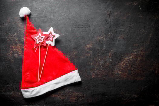 Red Christmas hat with Christmas decorations. photo