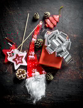 Red gift box with Christmas decorations and cones. photo