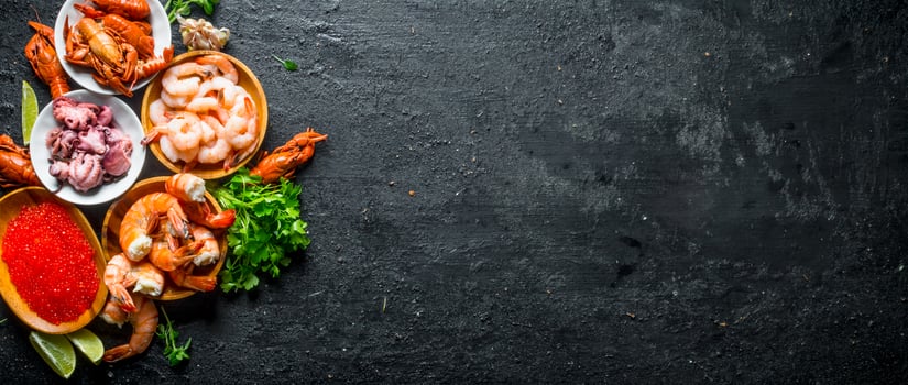 Red caviar with seafood, parsley and lime slices. photo