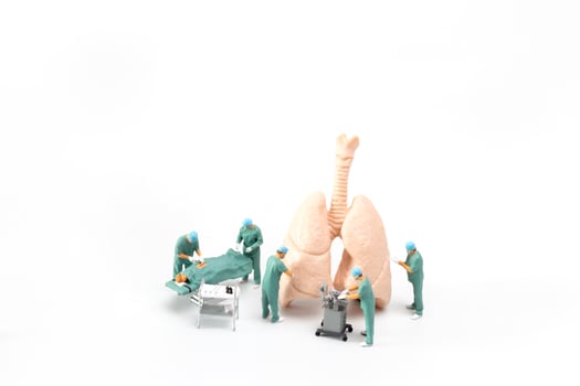Miniature Doctor and nurse medical team are performing surgical operation at emergency room photo