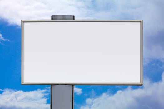Blank billboard against a cloudy sky photo
