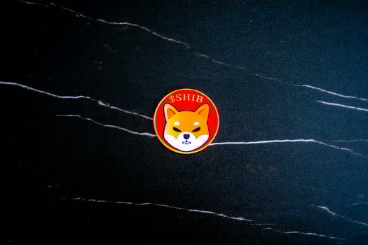 Shiba inu coin SHIB on black marble texture. photo