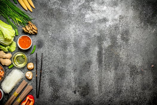 Asian food. Fresh ingredients for cooking Chinese food on a rustic background . photo