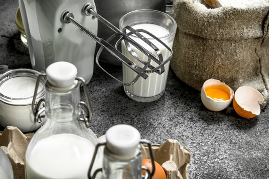 Baking background. Milk, flour and other ingredients for the dough. photo