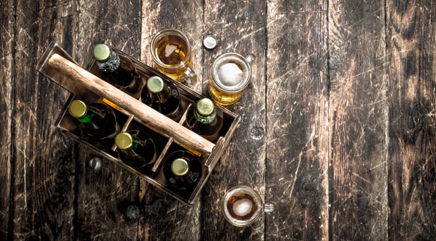 Bottles with beer in an old box. photo