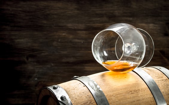 barrel with a glass of cognac. photo