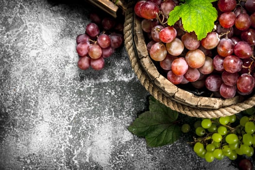 Fresh grapes in a wooden bucket. photo