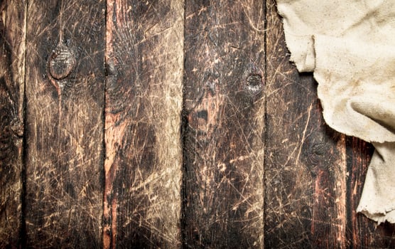 Old fabric. On a wooden table. photo