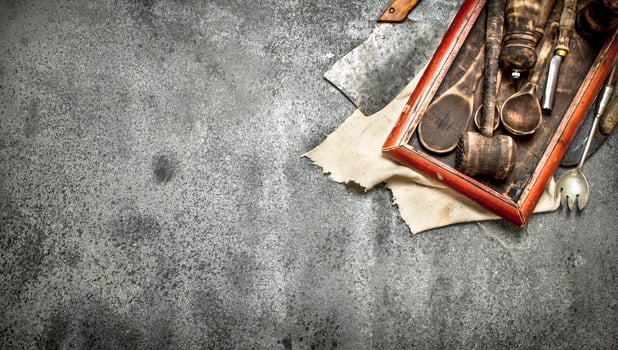 Serving background. Various kitchen tools on the old tray. photo