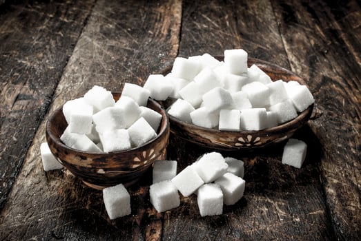 Cubes of sugar in a bowl. photo