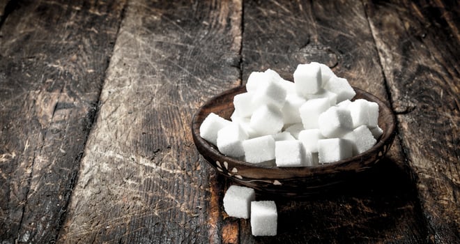 Cubes of sugar in a bowl. photo