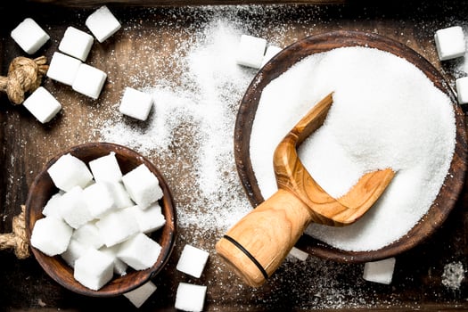 Sugar on an old wooden tray. photo