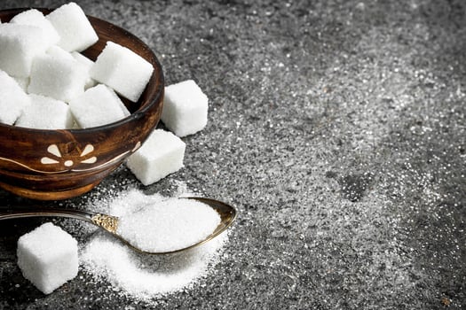 Sugar in a teaspoon. photo