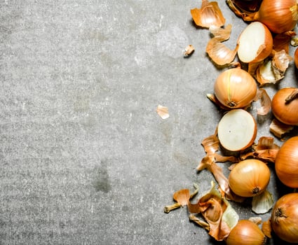 Fresh onion on stone background. photo