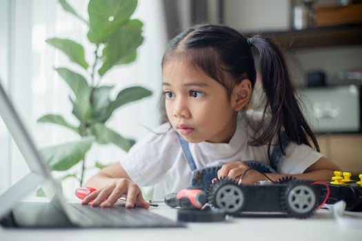 STEM education concept. Asian young girl learning robot design. photo