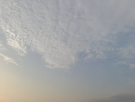 Nature background. Sky, sun and clouds with rays of light at sunset on the island of Lombok, Indonesia. photo