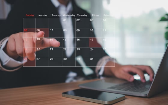 Businesswoman marking dates on virtual calendar, managing his business schedule, setting reminders for important appointments, creative collage for planning ideas, appointment scheduler photo