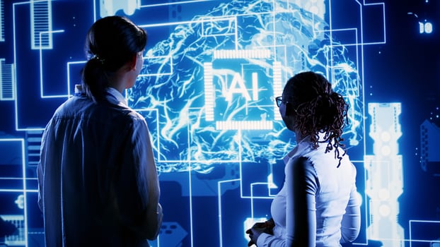Engineering coworkers looking at hologram of artificial intelligence human brain simulation. Skillful colleagues interacting with AR AI visualization showing machine learning algorithms photo
