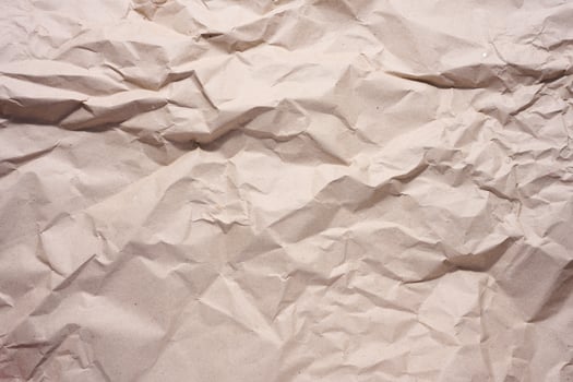 Texture of brown crumpled craft paper, full frame photo