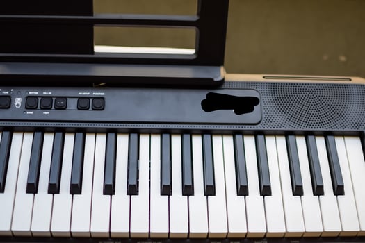 Close-up of piano keys. Piano black and white keys and Piano keyboard musical instrument placed at the home balcony during sunny day. photo