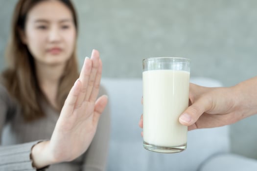 Milk allergens, Sick sad unhealthy ill allergic woman, runny stuffy sore nose suffer from intolerance allergy trigger symptoms. abdominal pain, allergens, nut protein, rash, death, food allergy photo