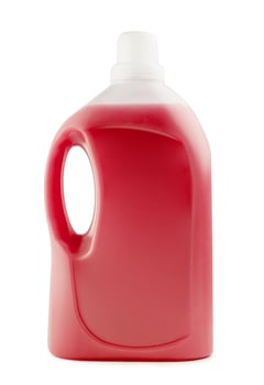 Plastic clean bottle full with red detergent photo