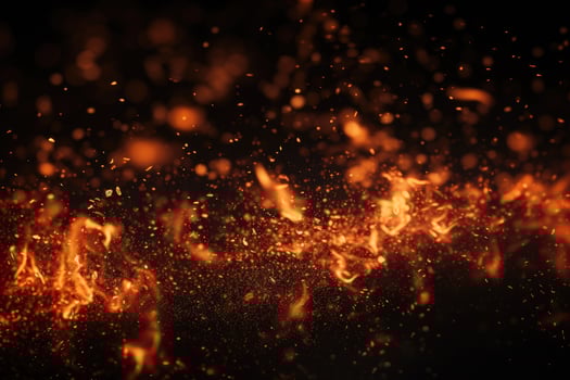 close up of burning fire flames on black background with bokeh effect, Detail of fire sparks isolated on black background, AI Generated photo