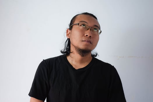 Adult Asian man wearing black t-shirt photo