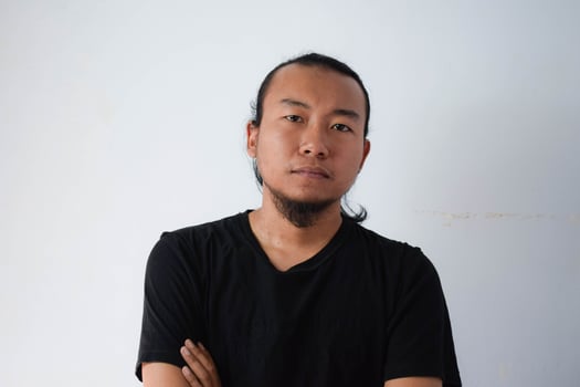 Adult Asian man wearing black t-shirt photo
