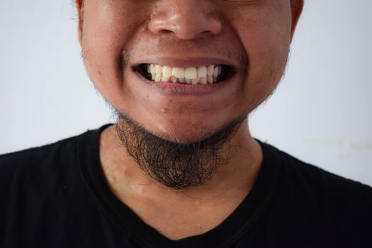 Adult Asian man wearing black t-shirt photo