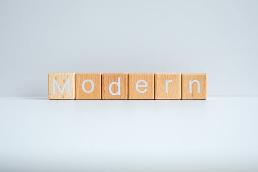 Wooden blocks form the text Modern against a white background. photo