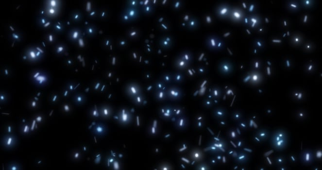 Abstract bright background of flying blue glowing light fire sparks from a fire on a black background photo