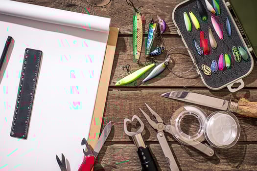 Accessories for fishing on the background of wood. Top view photo
