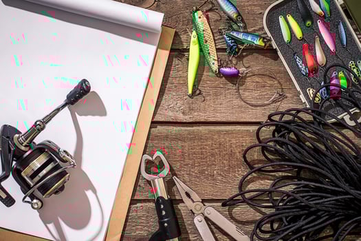 Accessories for fishing on the background of wood. Top view photo