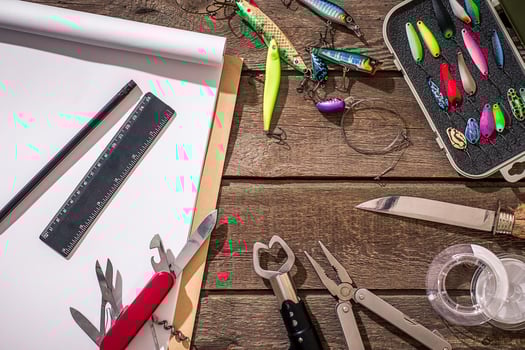 Fishing tackle - fishing spinning, fishing line, hooks and lures on wooden background. photo