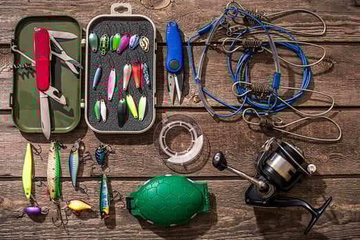 Accessories for fishing on the background of wood. Top view photo